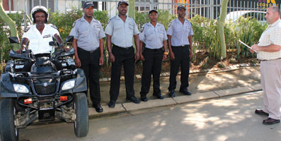 Bernardo Luis, operations director of Guarding SA is pictured right, taking the morning parade on site at an office park which is secured by the company’s services.